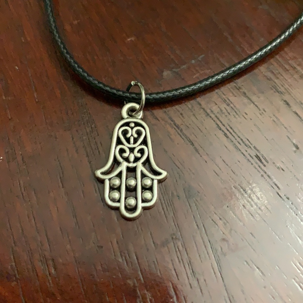 Silver hamsa pendant on black cord necklace